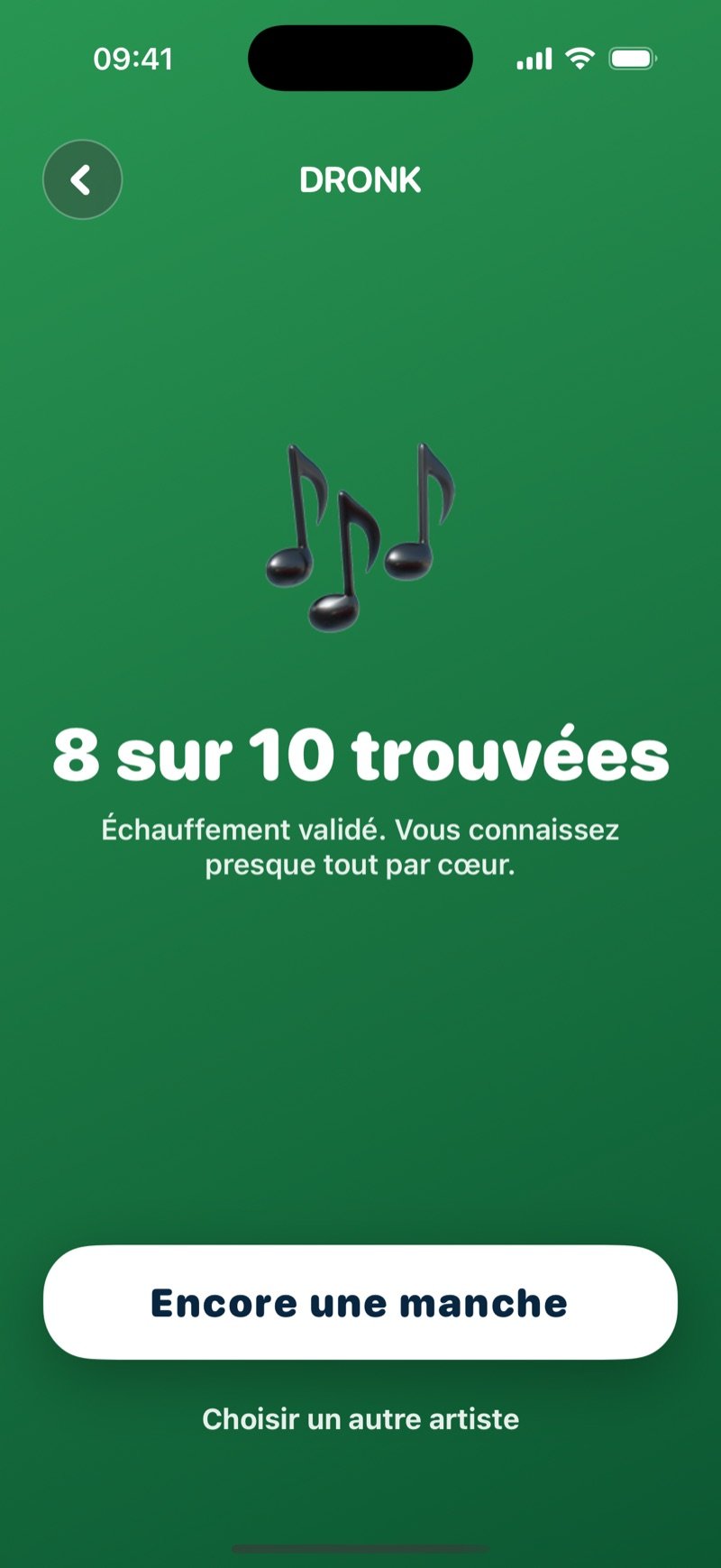 L'écran de résultat du Blind test : une grande icône de note, 8 of 10 correct, la ligne Warm-up approved, you can sing along to most of it, un bouton One more round et un lien Pick another artist (capture de la version anglaise)
