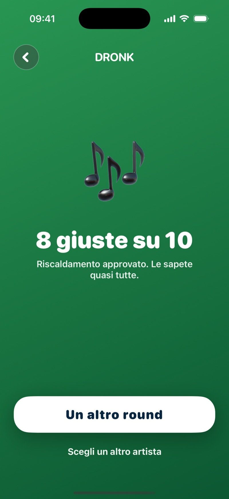 La schermata del risultato di Indovina la canzone: una grande nota, 8 of 10 correct, la frase Warm-up approved, you can sing along to most of it, un pulsante One more round e un link Pick another artist (screenshot della versione inglese)