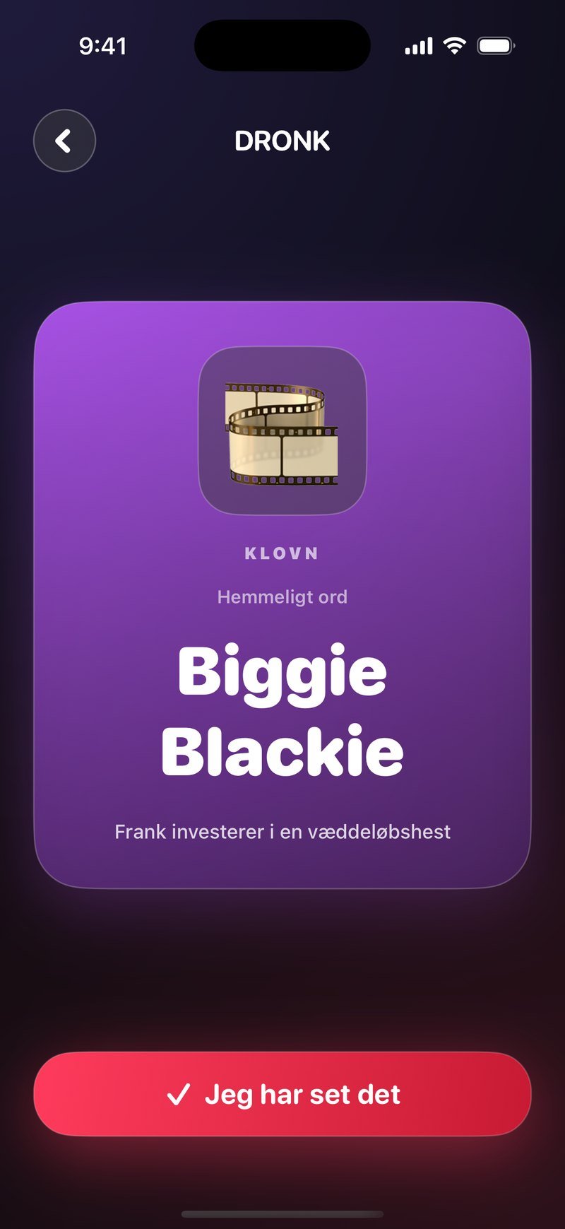 Det civile kort i Dronk: lilla kort med kategorien Klovn, overskriften Hemmeligt ord, ordet Biggie Blackie, kontekstlinjen Frank investerer i en væddeløbshest og knappen Jeg har set det