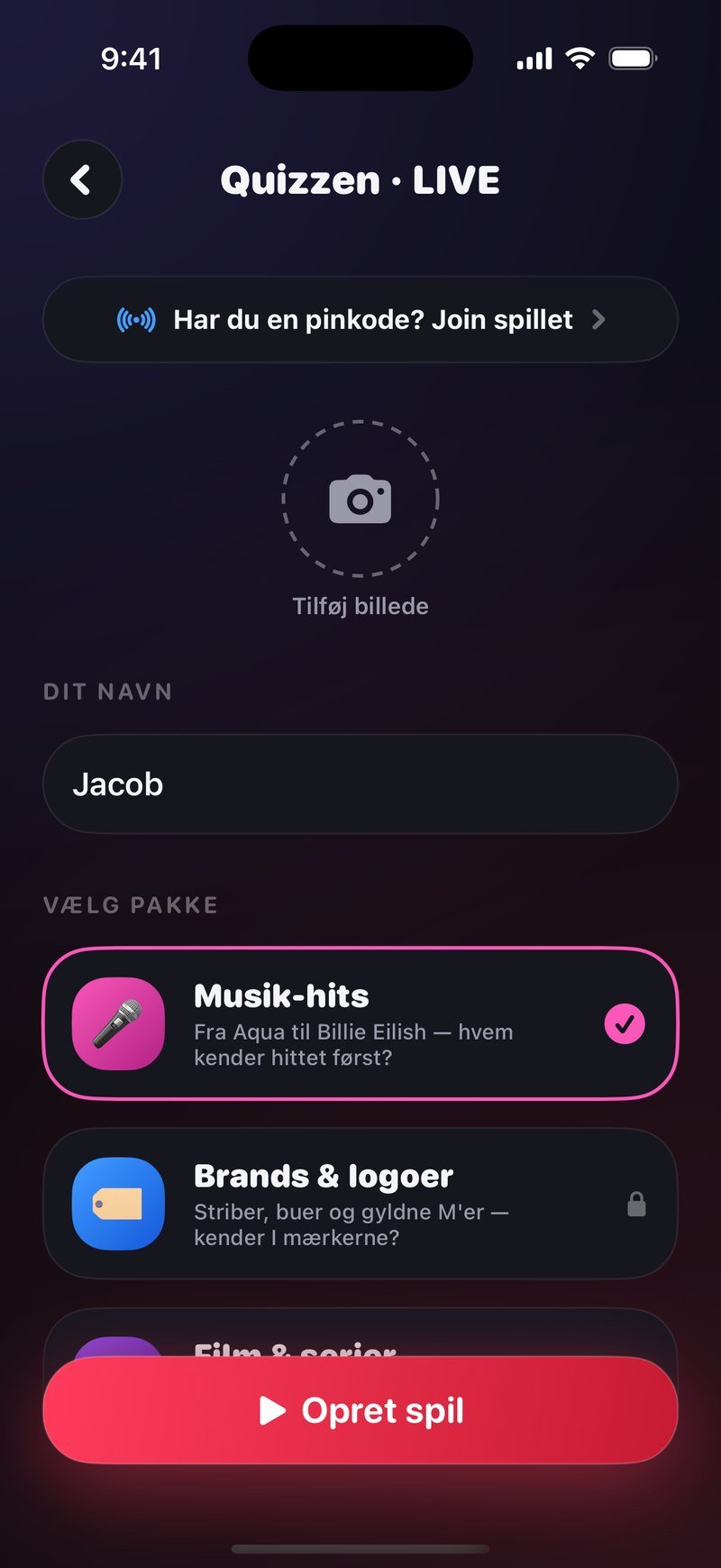 Opret-skærmen i Dronk: overskriften Quizzen · LIVE, feltet Dit navn med Jacob, overskriften Vælg pakke med Musik-hits valgt og Brands & logoer nedenunder, og knappen Opret spil