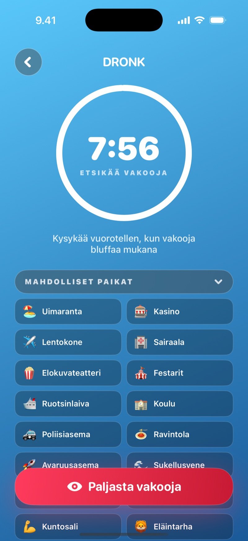 Kysymyskierros Vakoojassa: ajastinrengas, ohje Kysykää vuorotellen, kun vakooja bluffaa mukana, pakan mahdolliset paikat ruudukkona ja Paljasta vakooja -painike