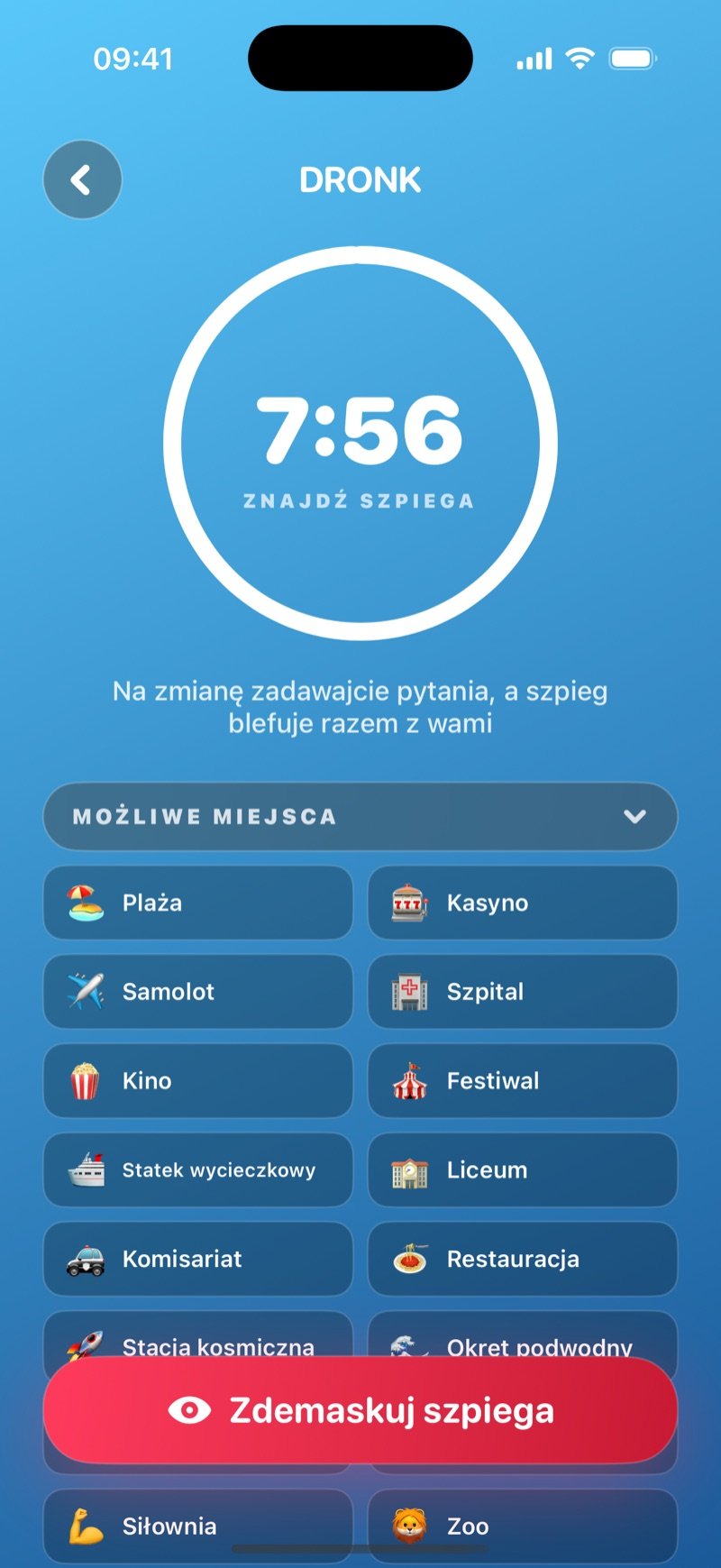 Runda pytań w Szpiegu: pierścień timera na 7:54 z napisem Find the spy, linia Take turns asking questions, the spy bluffs along, siatka Possible Locations z The Beach, The Casino, The Plane, The Hospital i innymi oraz przycisk Reveal the spy (zrzut z wersji angielskiej)