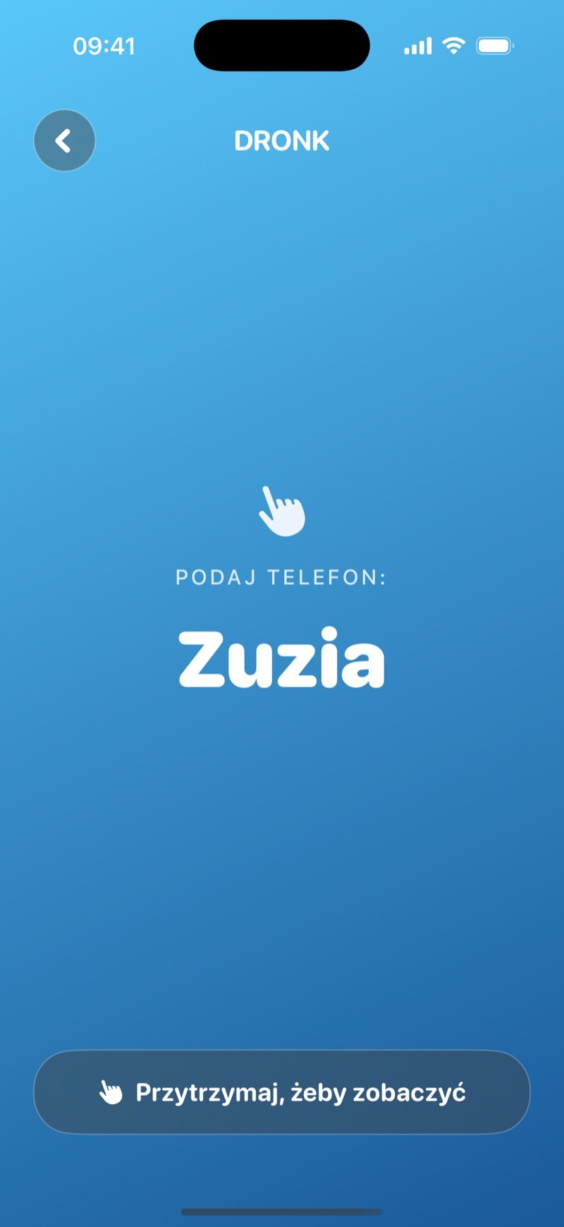 Ekran podawania telefonu w Szpiegu na niebieskim gradiencie: Pass the phone to Olivia, przycisk Hold to reveal i wciąż zakryta karta (zrzut z wersji angielskiej)
