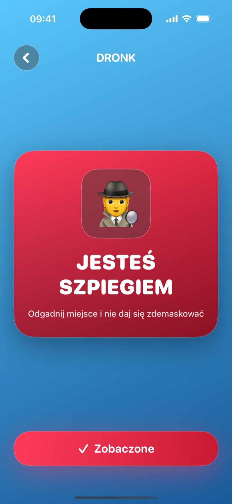Karta szpiega w grze Szpieg: czerwona karta z napisem You are the spy, guess the location without giving yourself away (zrzut z wersji angielskiej)