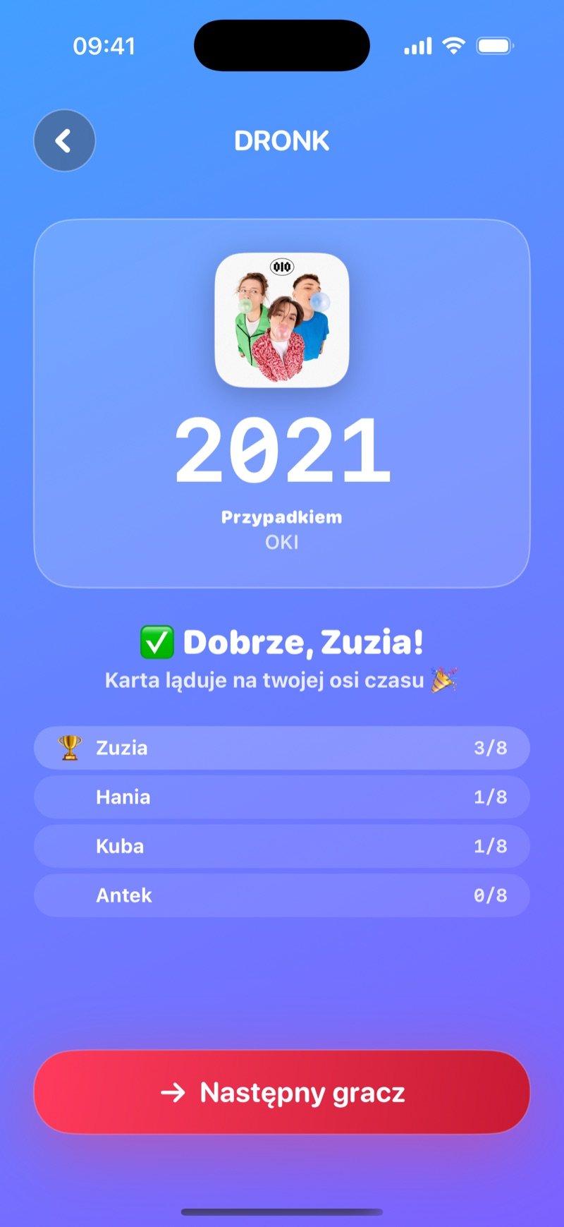 Odsłonięcie w Osi czasu: duże 2014 nad Shake It Off Taylor Swift, tekst Correct, Olivia! The card lands on your timeline, tabela Olivia 3/8, Jake 1/8, Mia 1/8, Tyler 0/8 i przycisk Next player (zrzut z wersji angielskiej)
